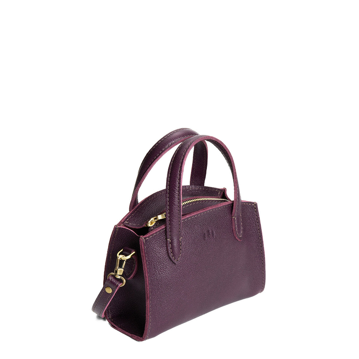 Plum*Mini | Leather tote bag with handles, adjustable crossbody strap, zipper top, and a back pocket