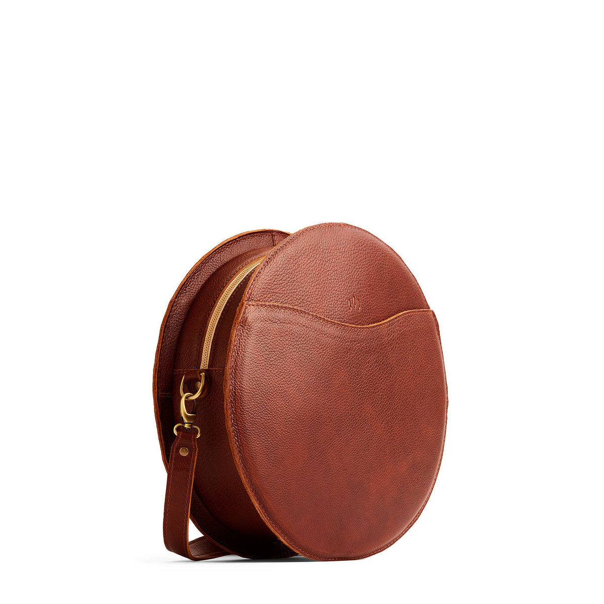 Nutmeg | Large circle shaped leather bag with top zipper and carrying strap