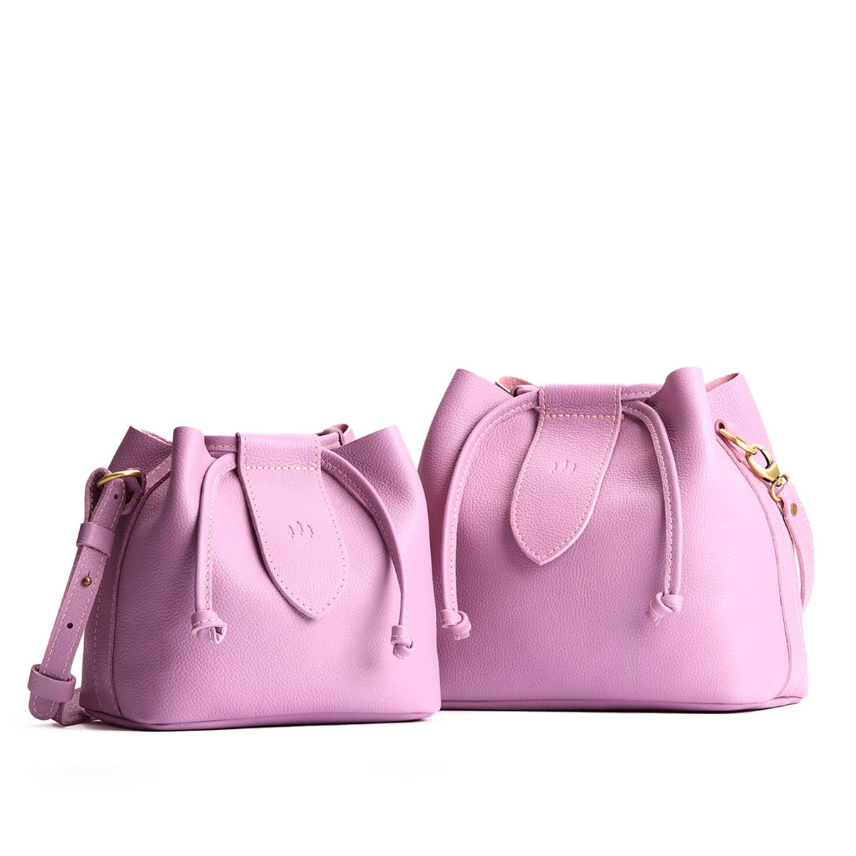 Calla Lily | Small and large symmetrical leather bags with leather drawstring closure and adjustable shoulder strap