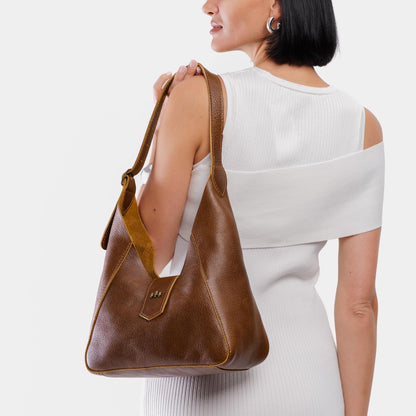 Asheville | Model wearing structured hobo shoulder bag with adjustable strap and magnetic closure