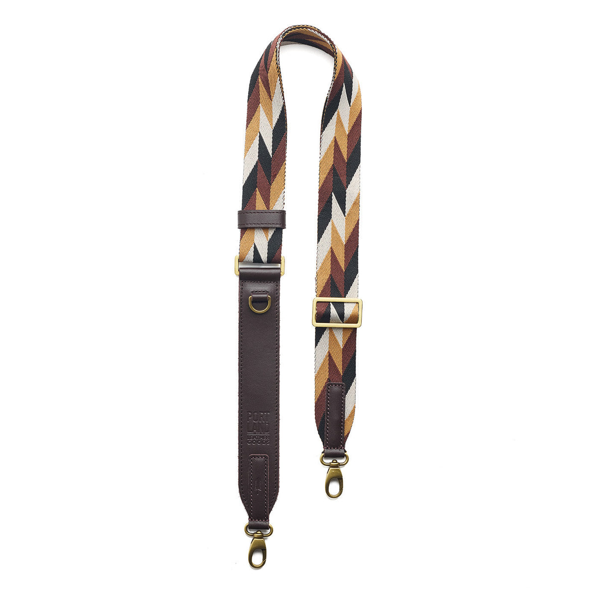 Golden Dusk | Patterned fabric and leather strap on a white background