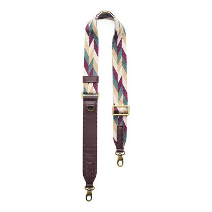 Mystic Motion | Patterned fabric and leather strap on a white background