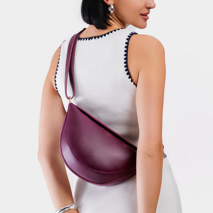 Lollipop*Medium | Model wearing half circle shaped sling bag