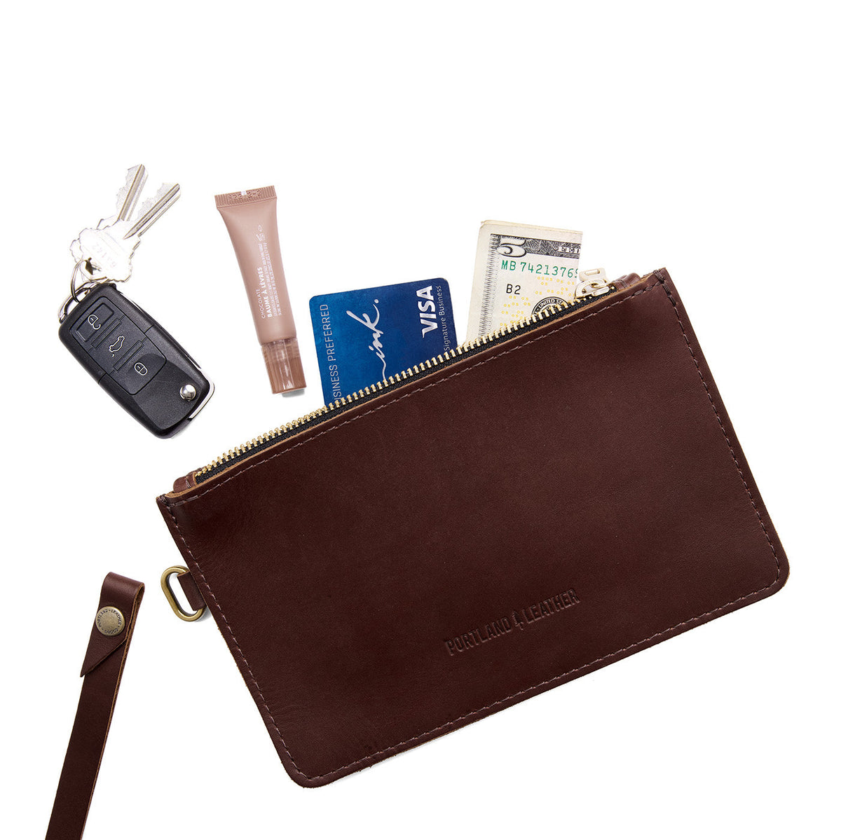 Cognac | Leather wristlet with two zippered pockets and removable wrist strap