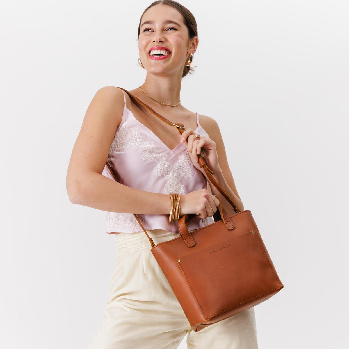 Honey*Zipper | Model holding crossbody tote bag with zipper closure and front pocket