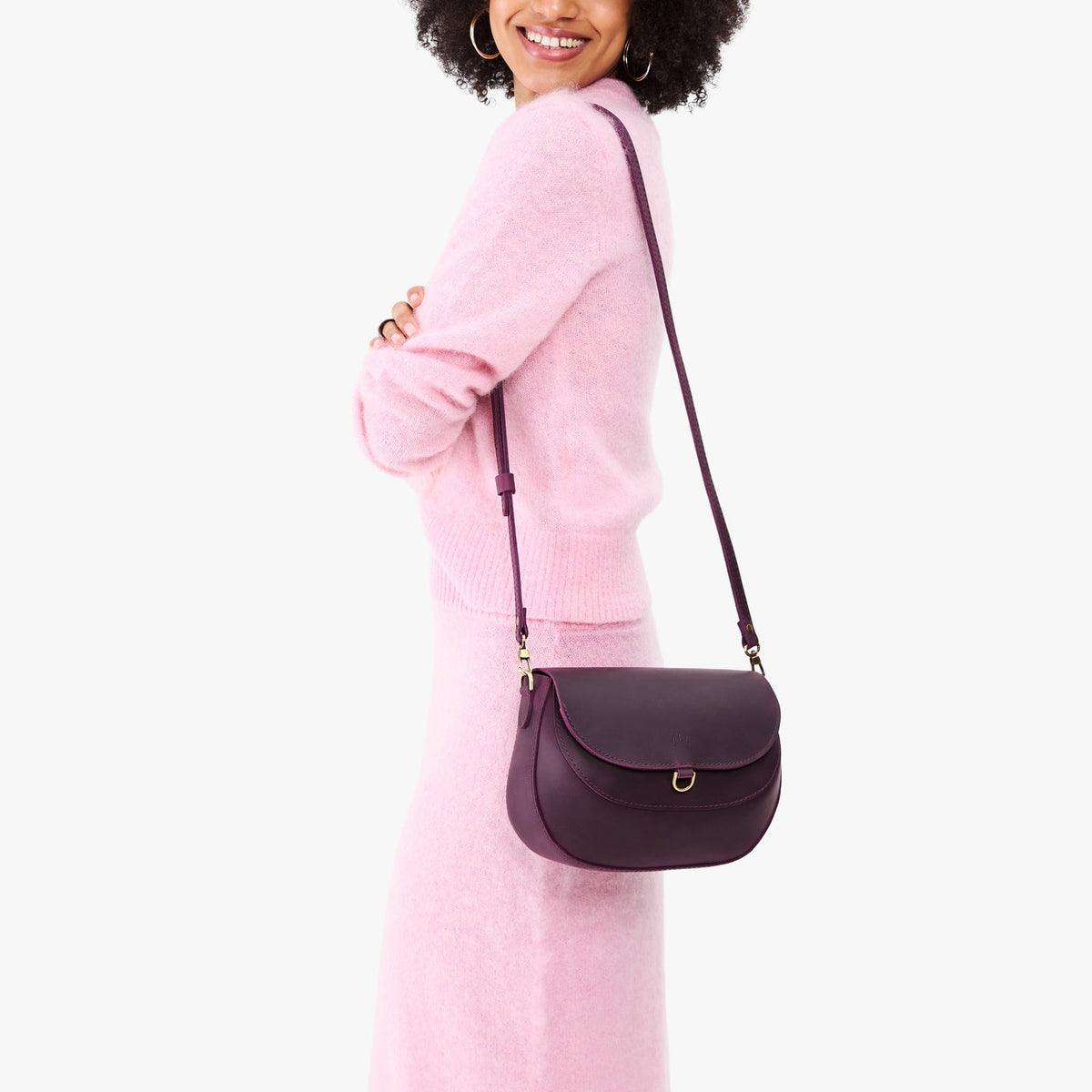 Larkspur*Large | Model wearing a leather Crossbody with a flap and magnetic closure
