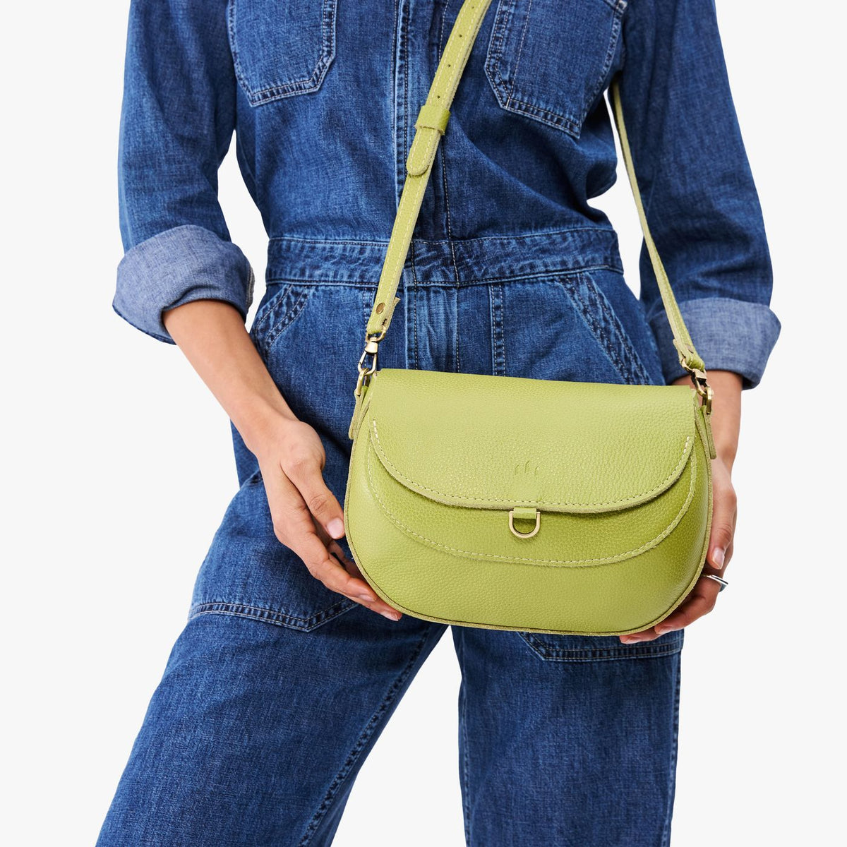 Wasabi*Large | Model wearing a petite leather Crossbody with a flap and magnetic closure