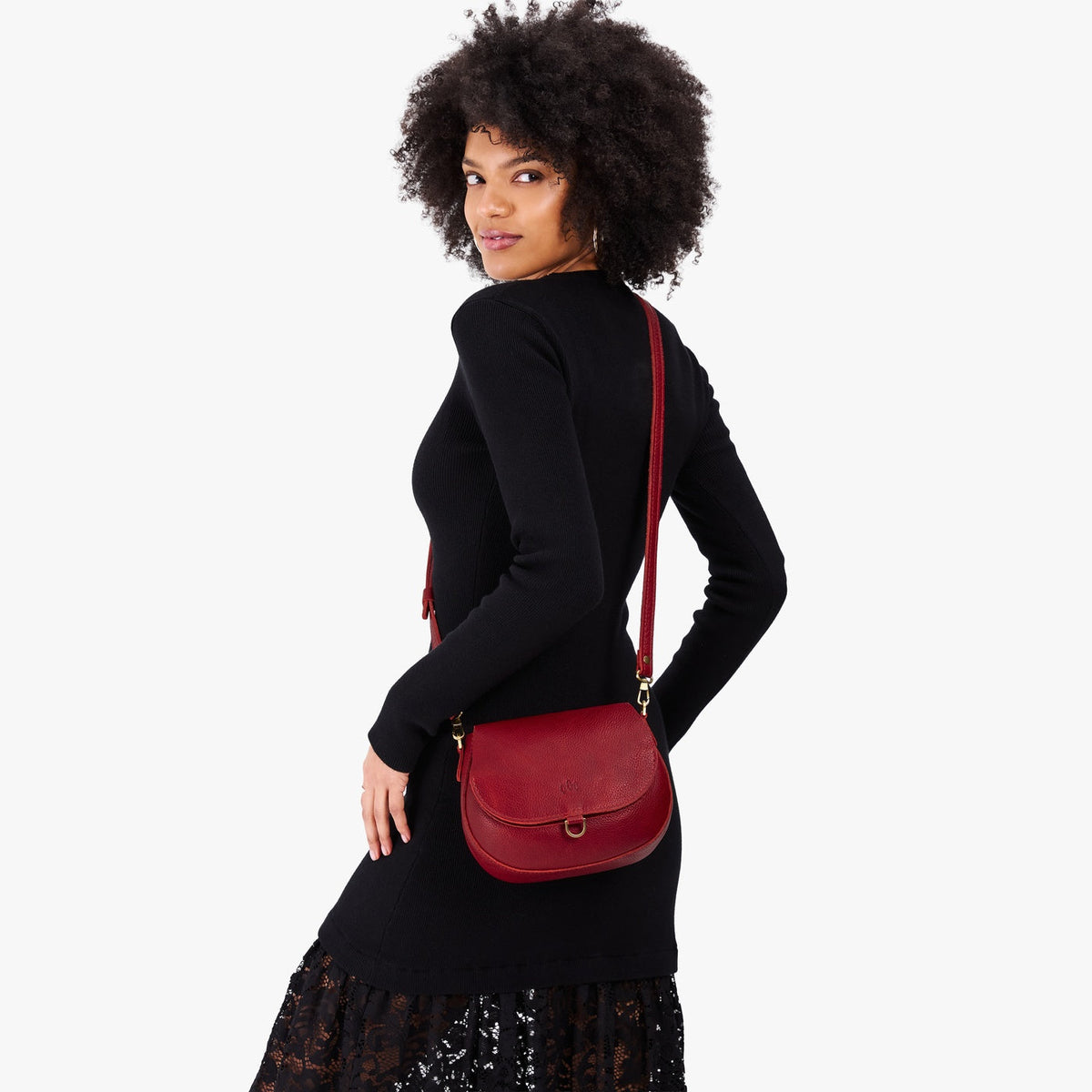 Chili Red*Small | Model wearing a petite leather Crossbody with a flap and magnetic closure