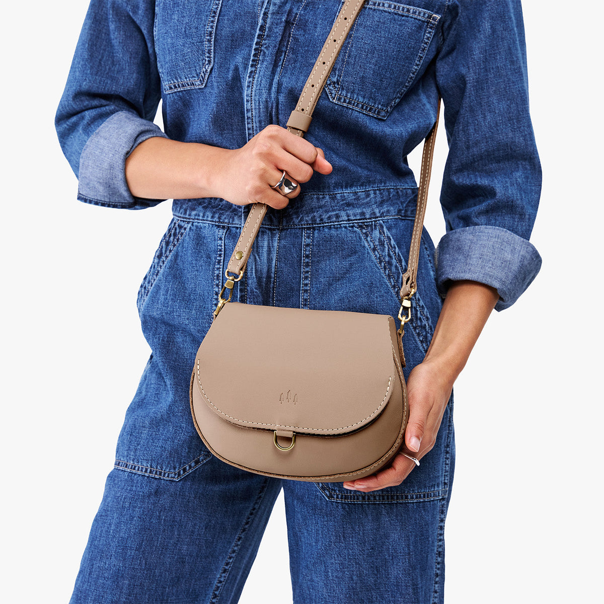 Stone*Small | Model wearing a petite leather Crossbody with a flap and magnetic closure