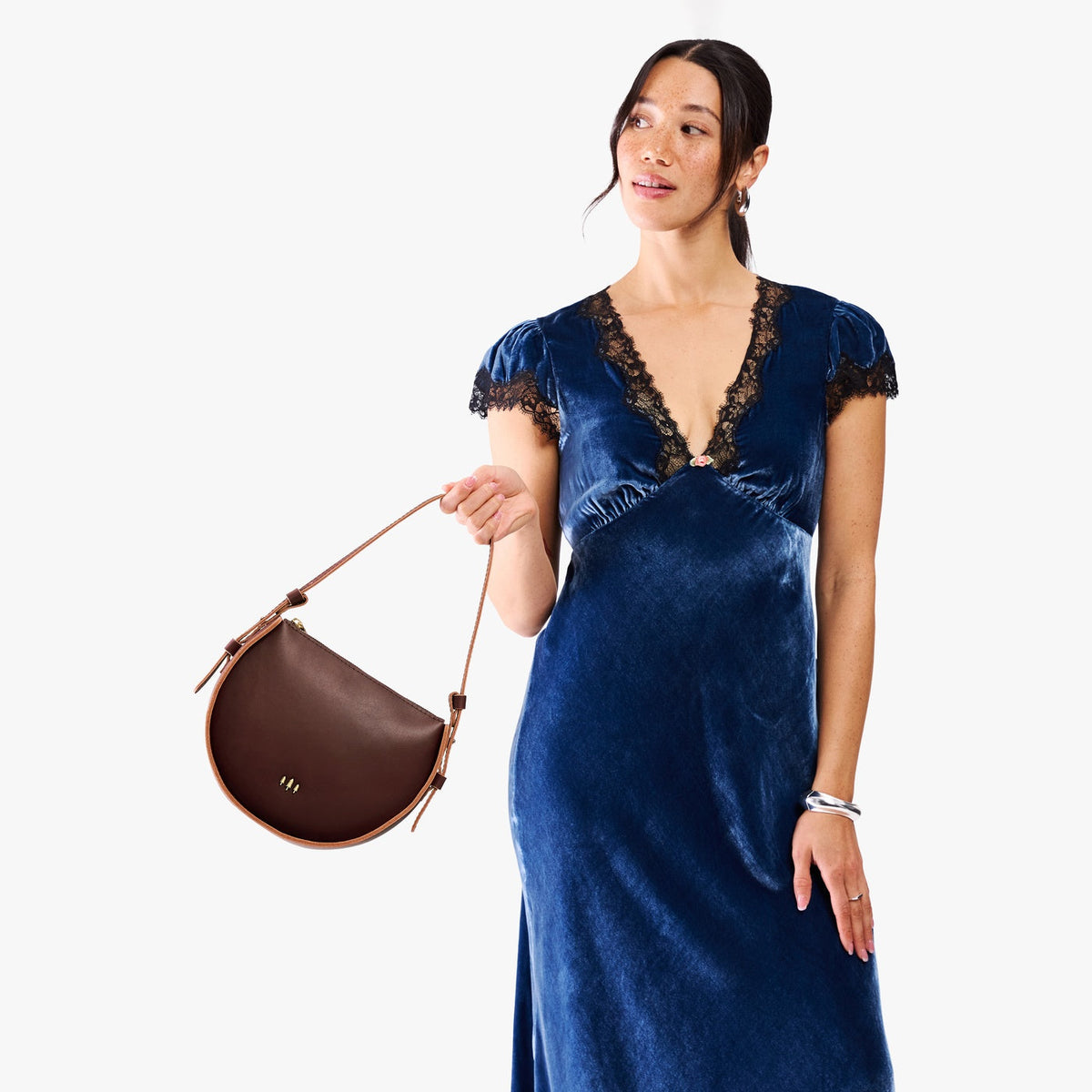 Cognac | Model wearing a rounded structured shoulder bag