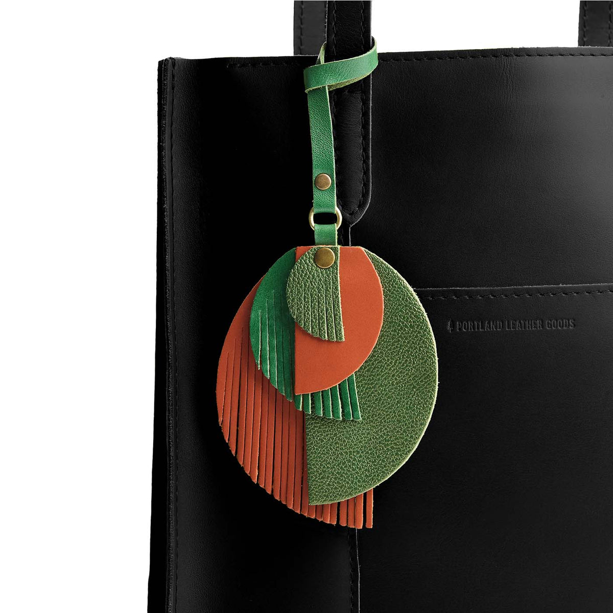 Jungle | Intricately cut leather shapes and fringe