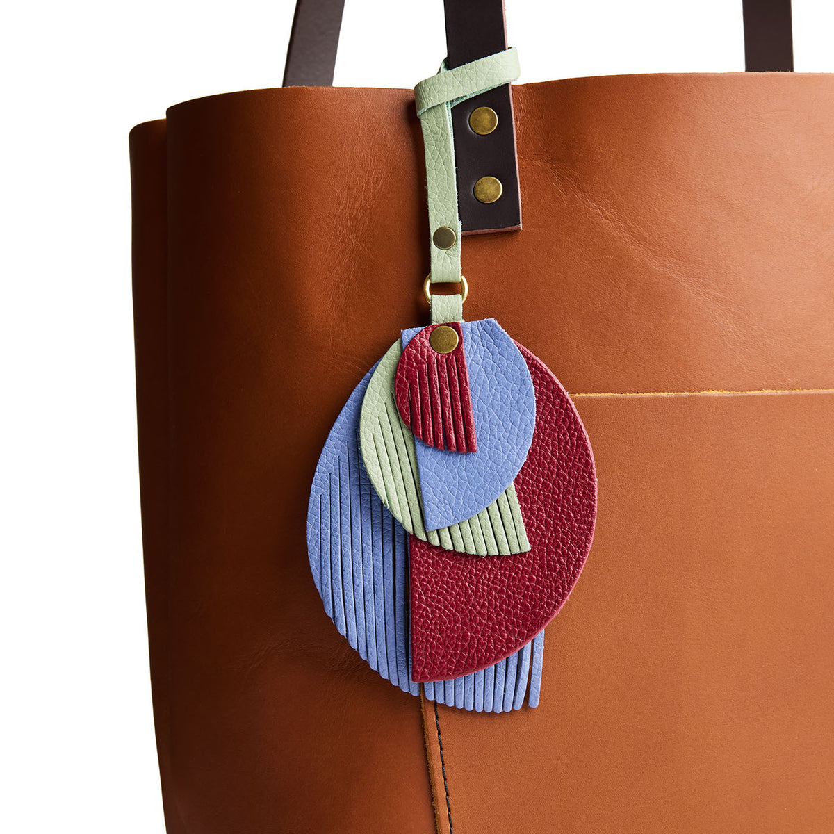 Obsession | Intricately cut leather shapes and fringe