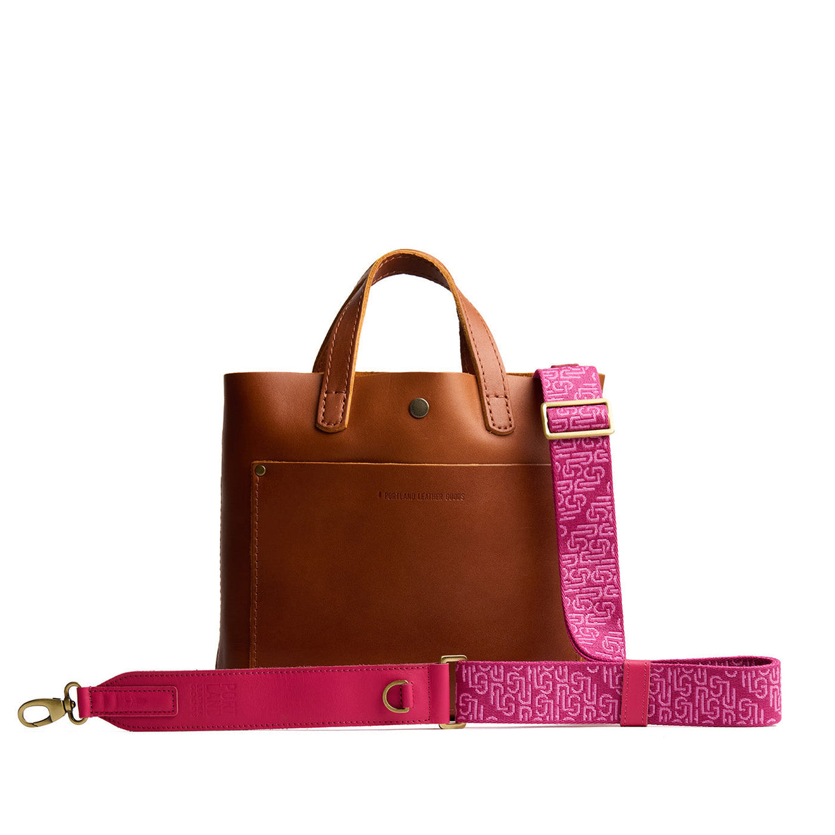 Pink Punk | Leather and webbing strap with repeating PLG lettering on a leather bag
