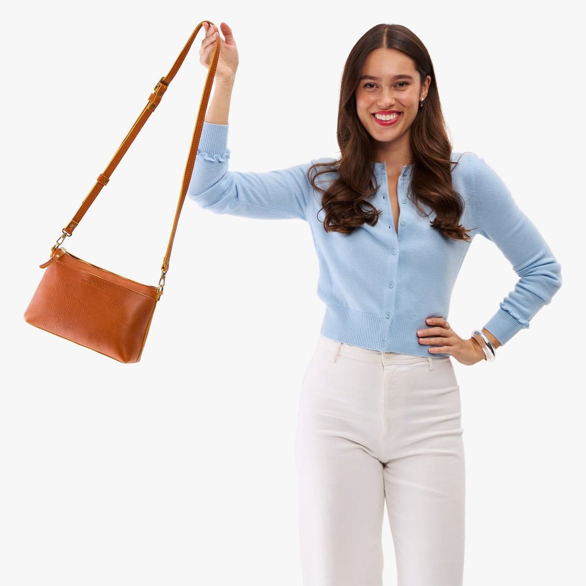 Sienna*Small | Model wearing a zip top crossbody bag with detachable strap