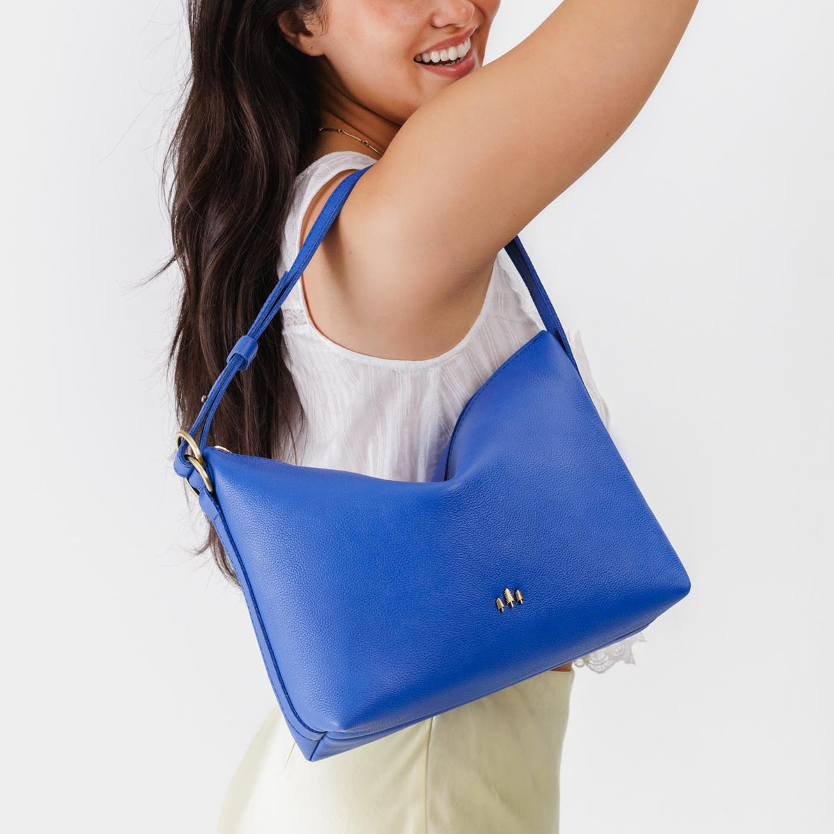 Astro Blue*Large | Medium sized slouchy leather shoulder bag with zipper opening and three metal tree emblems