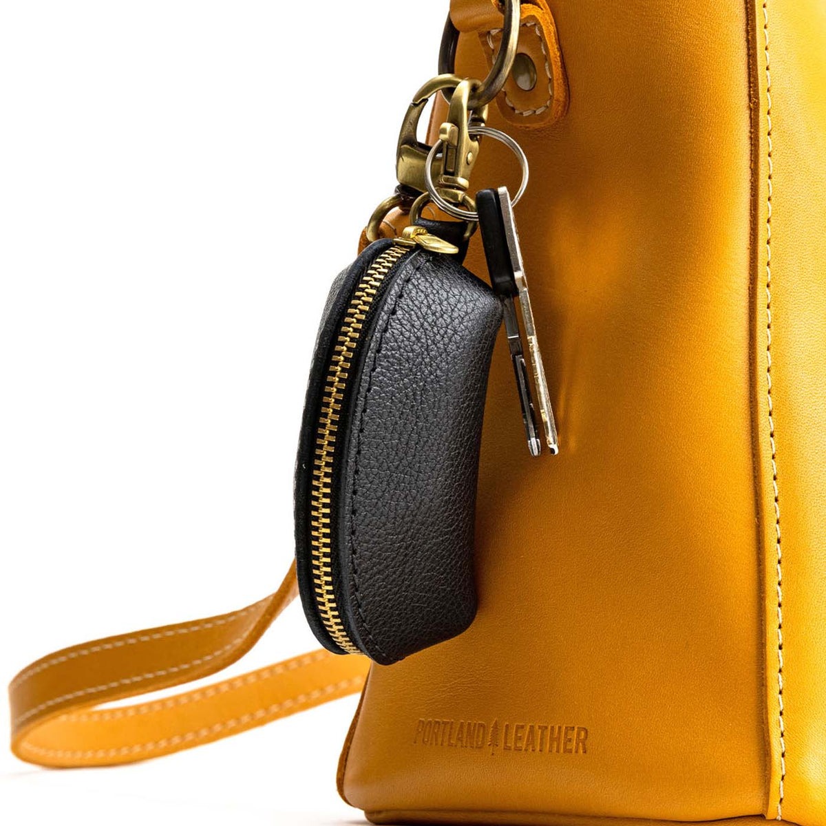 Pebbled--black | Taco shaped leather pouch with zipper and swivel lobster clasp on bag