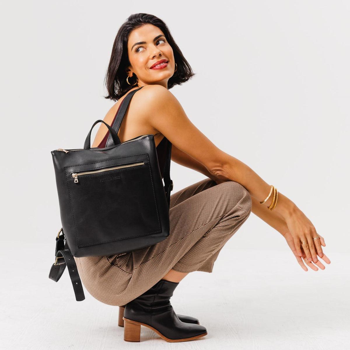All Color: Black*Classic | Model wearing square slim leather tote backpack